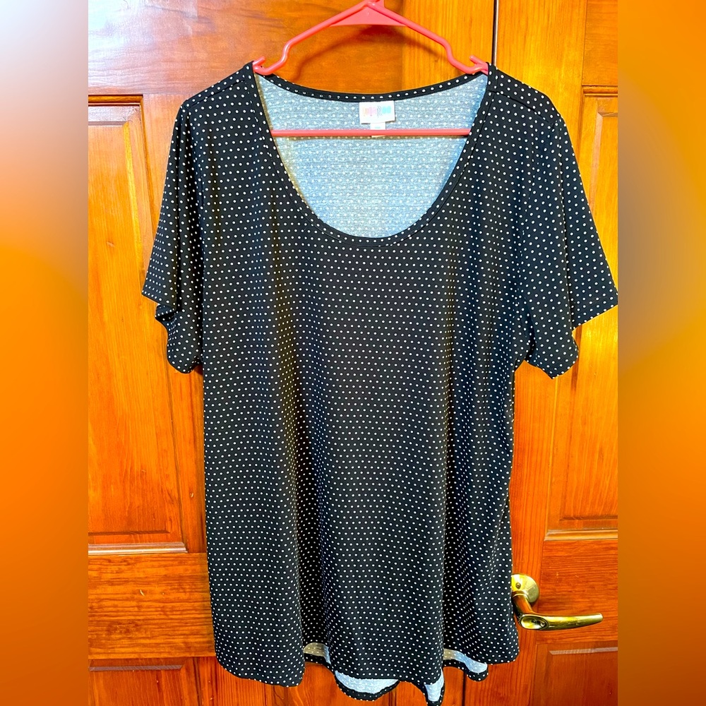 Two black & white-polka dot tops, one has a little bigger dots than the other.